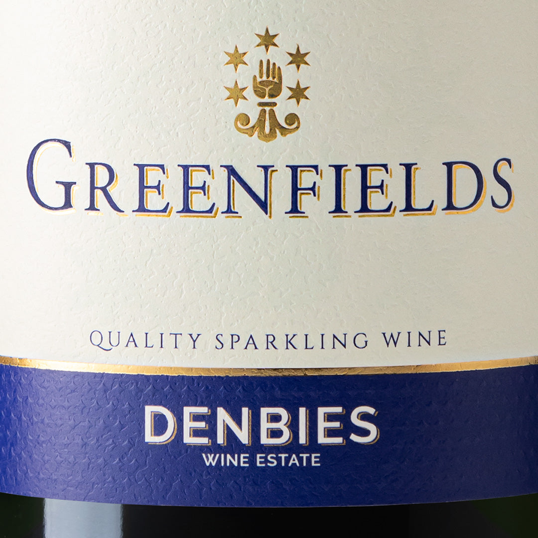 Close-up detail of the Greenfields NV wine label showing the art and typography