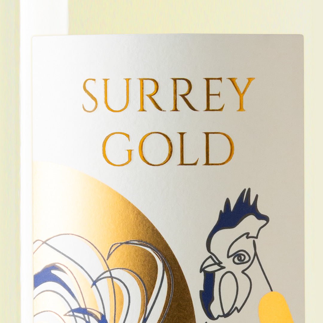 Close-up detail of the Surrey Gold wine label showing the art and typography