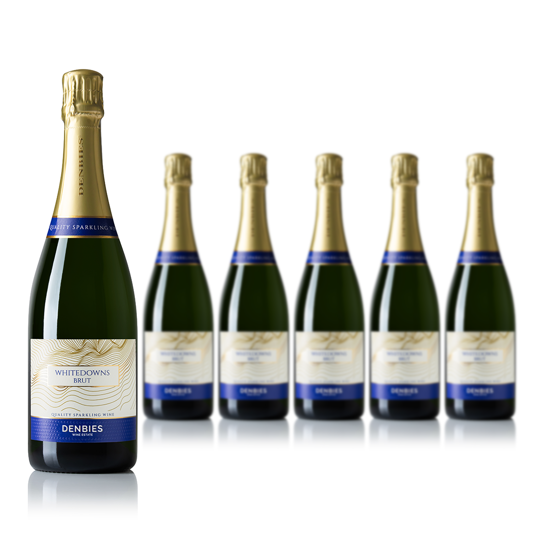 Front view of six Whitedowns NV wine bottles by Denbies Wine Estate isolated on a transparent background