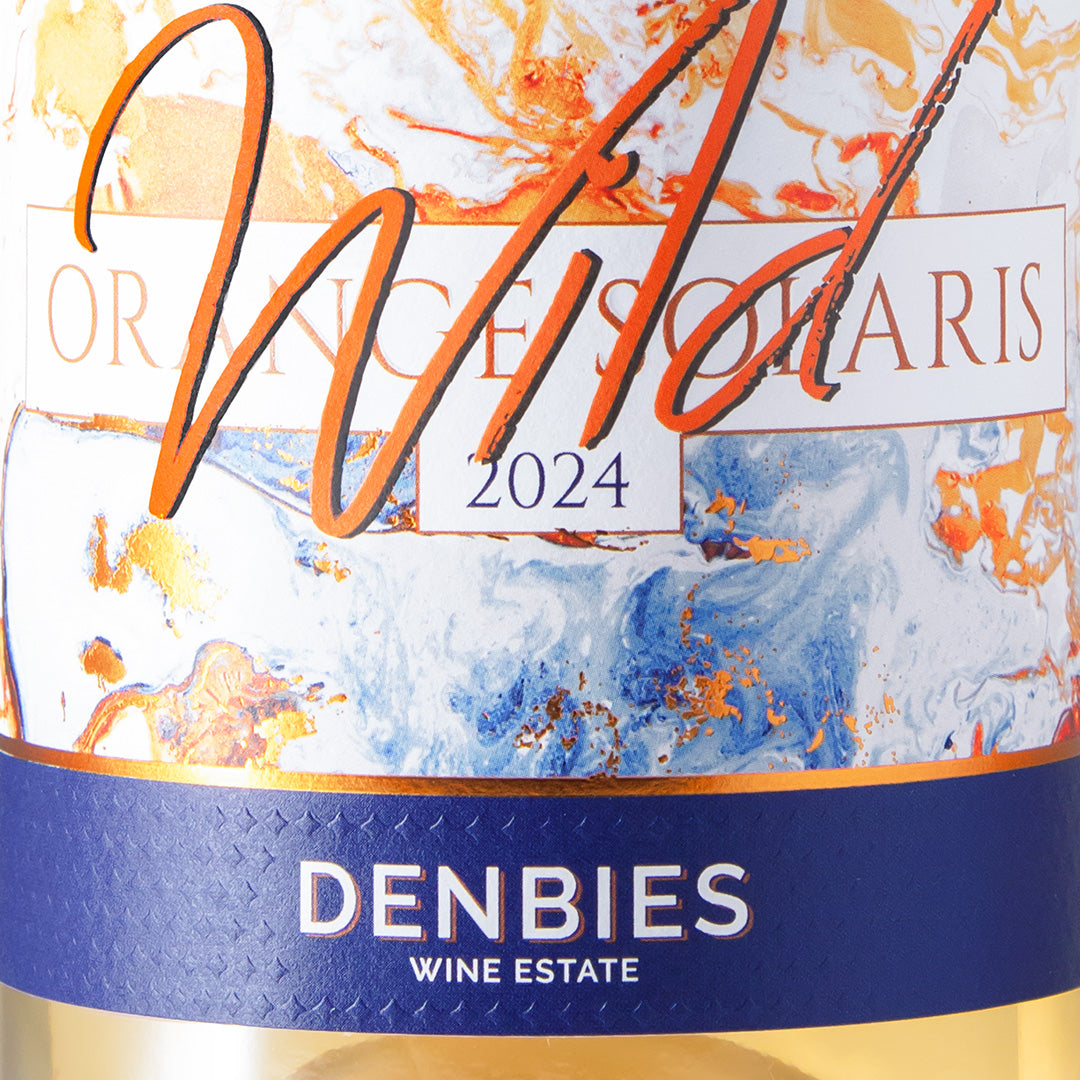 Close-up detail of the Wild Orange Solaris wine label showing the art and typography