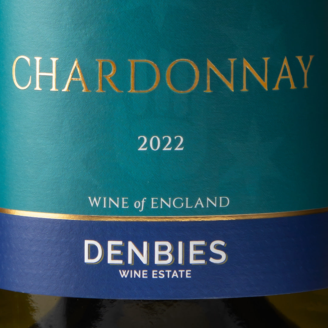 Close-up detail of the Chardonnay 2022 wine label showing the art and typography
