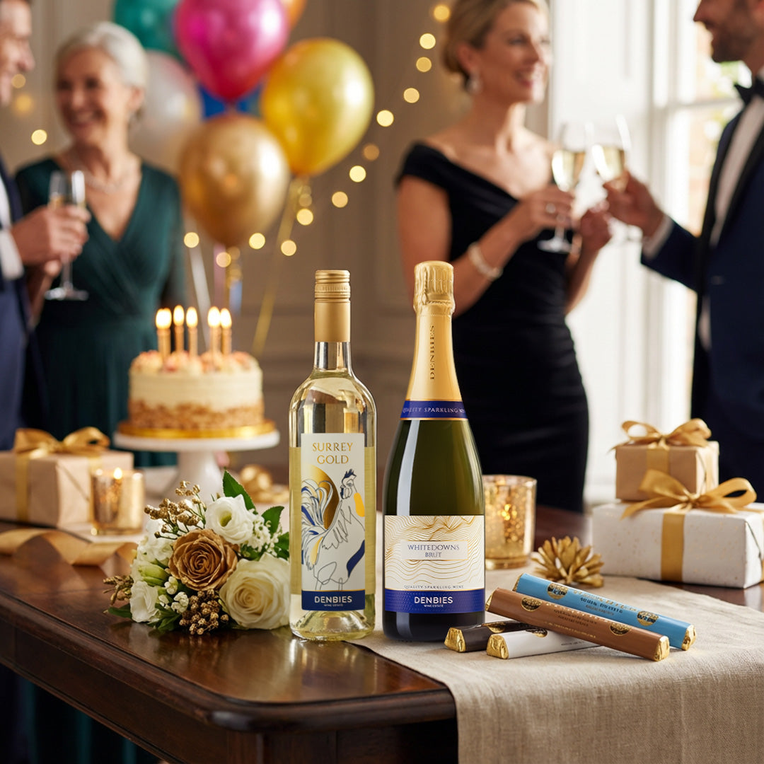 Surrey Gold, Whitedowns Brut and Denbies chocolate laid out on a set table in a party setting