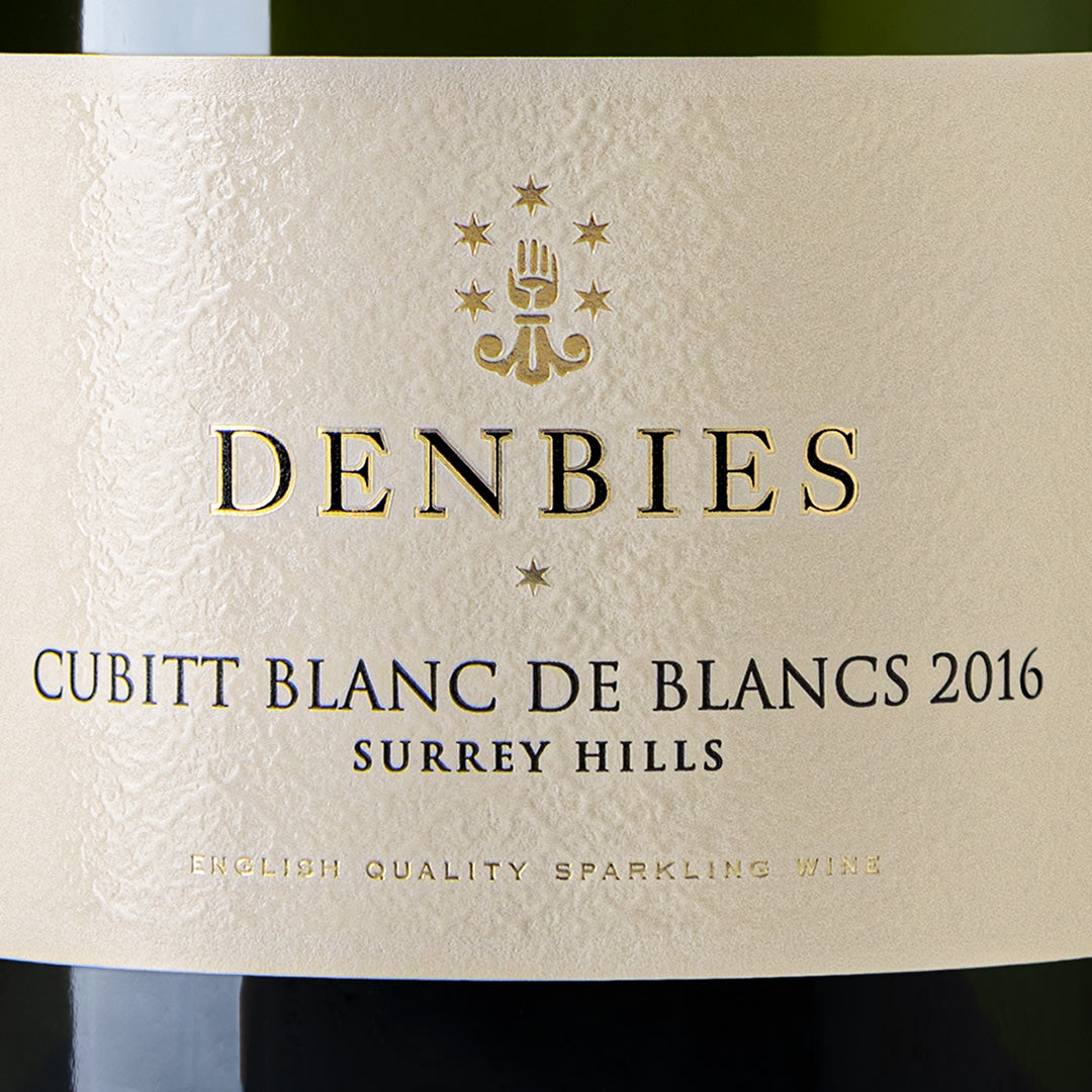 Close-up detail of the Cubitt Blanc de Blancs 2016 wine label showing the art and typography