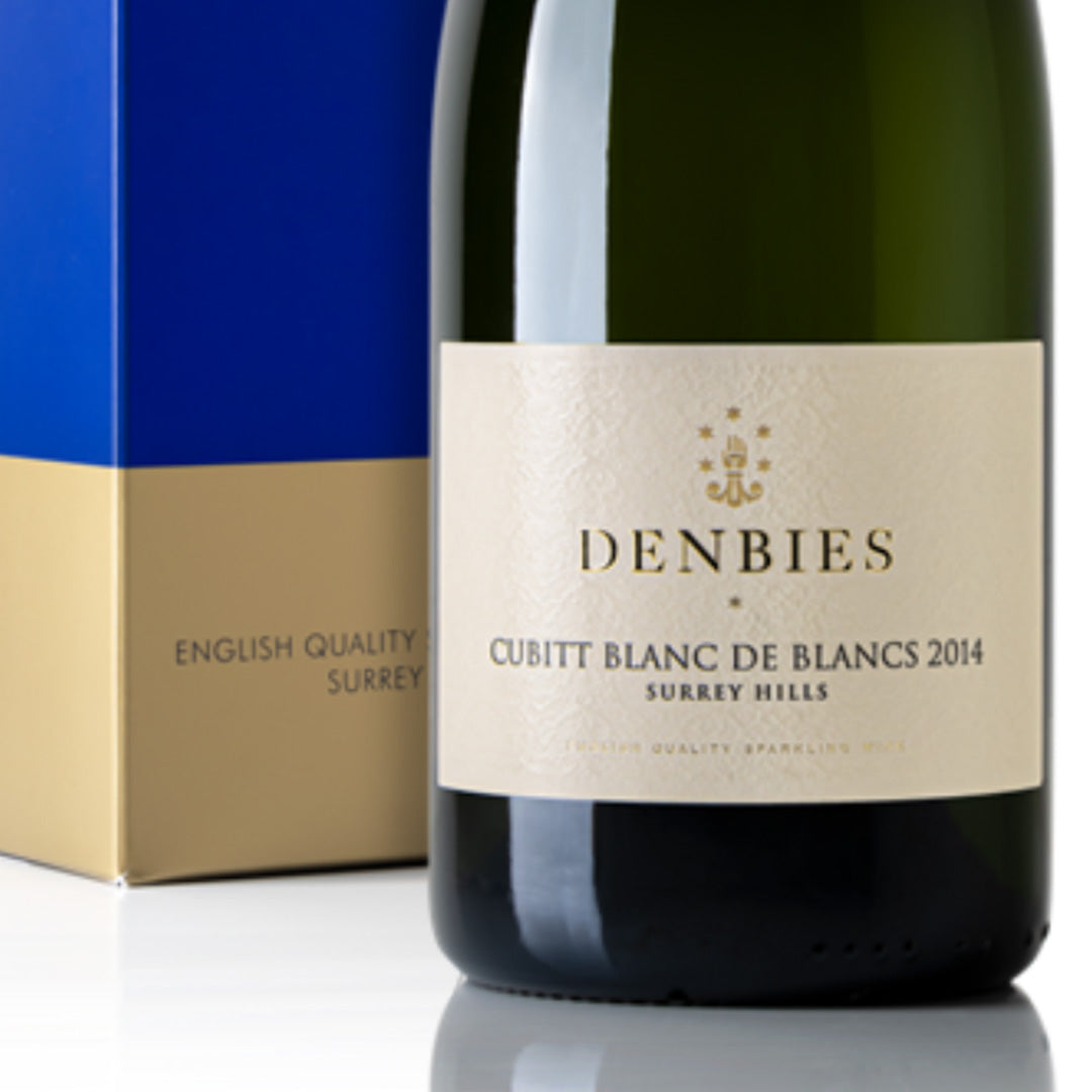 Close-up detail of the Cubitt Blanc de Blancs 2014 wine label and gift box showing the art and typography