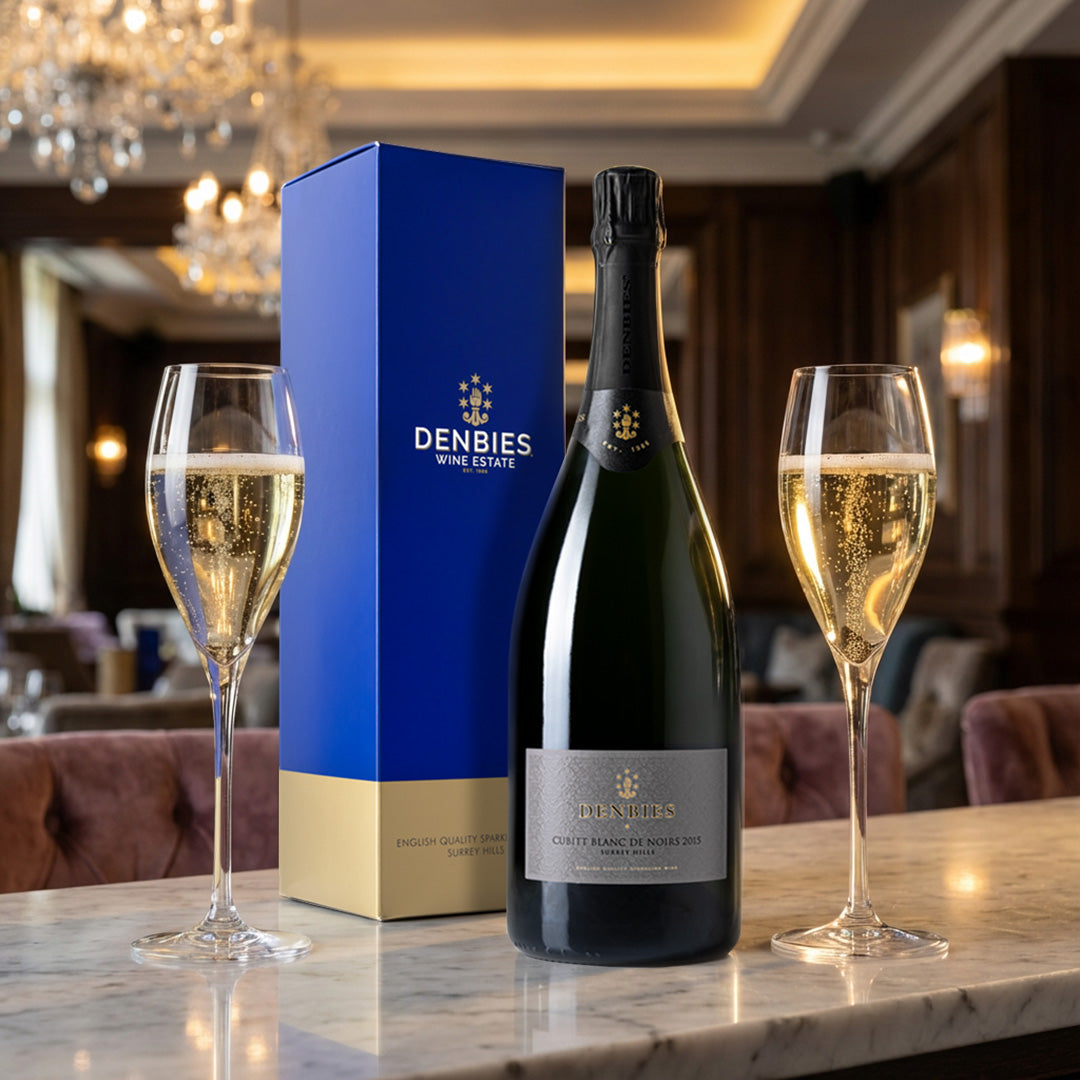 Cubitt Blanc de Noirs 2015 wine bottle served with two glasses and the magnum gift box on a marble counter
