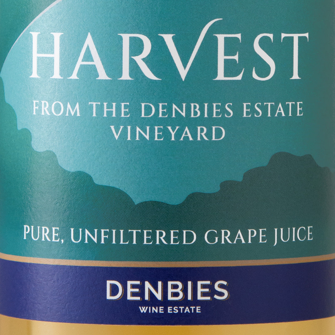 Close-up detail of the Harvest Grape Juice label showing the art and typography