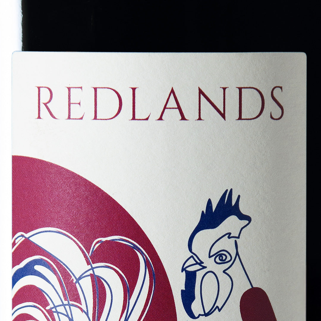Close-up detail of the Redlands wine label showing the art and typography