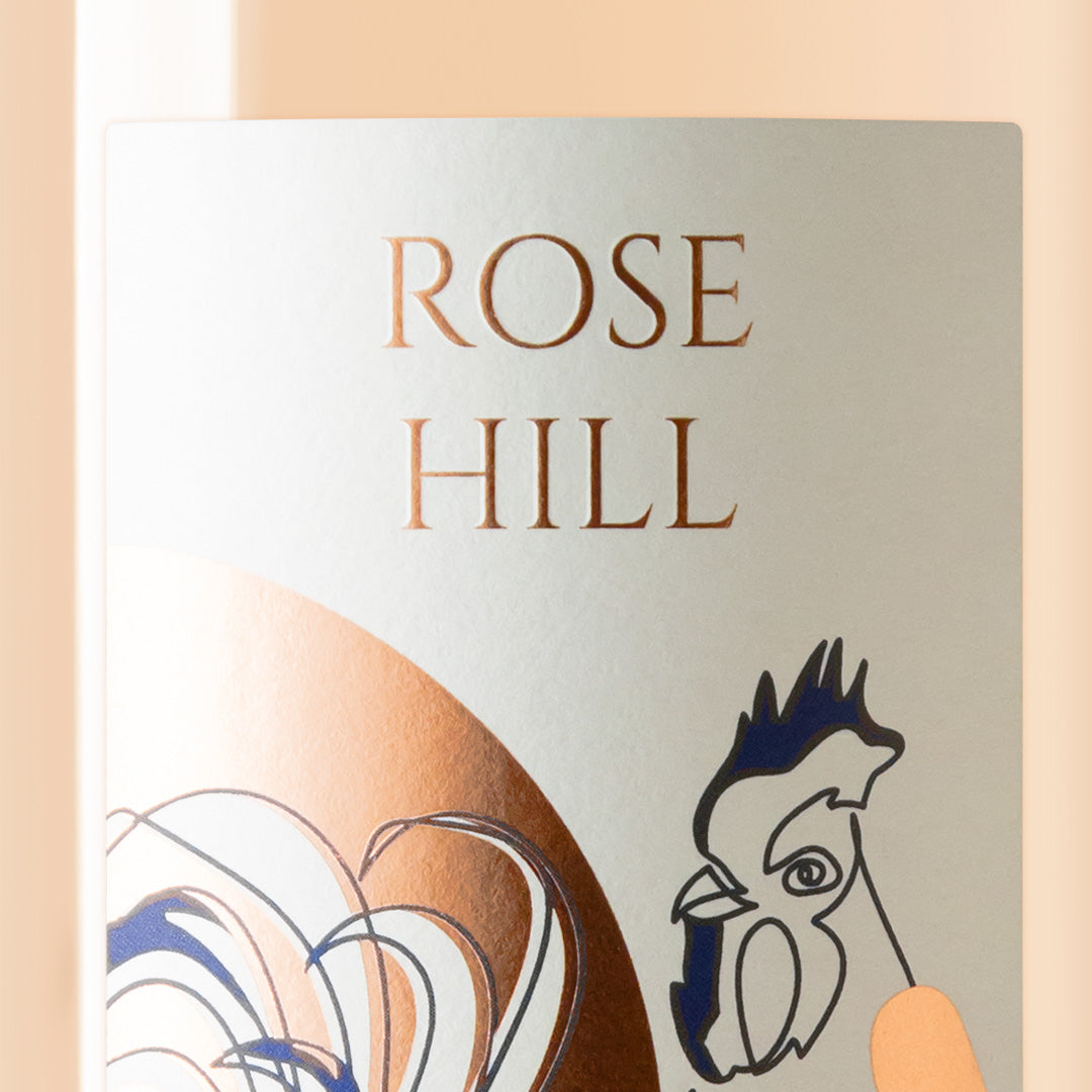 Close-up detail of the Rose Hill wine label showing the art and typography